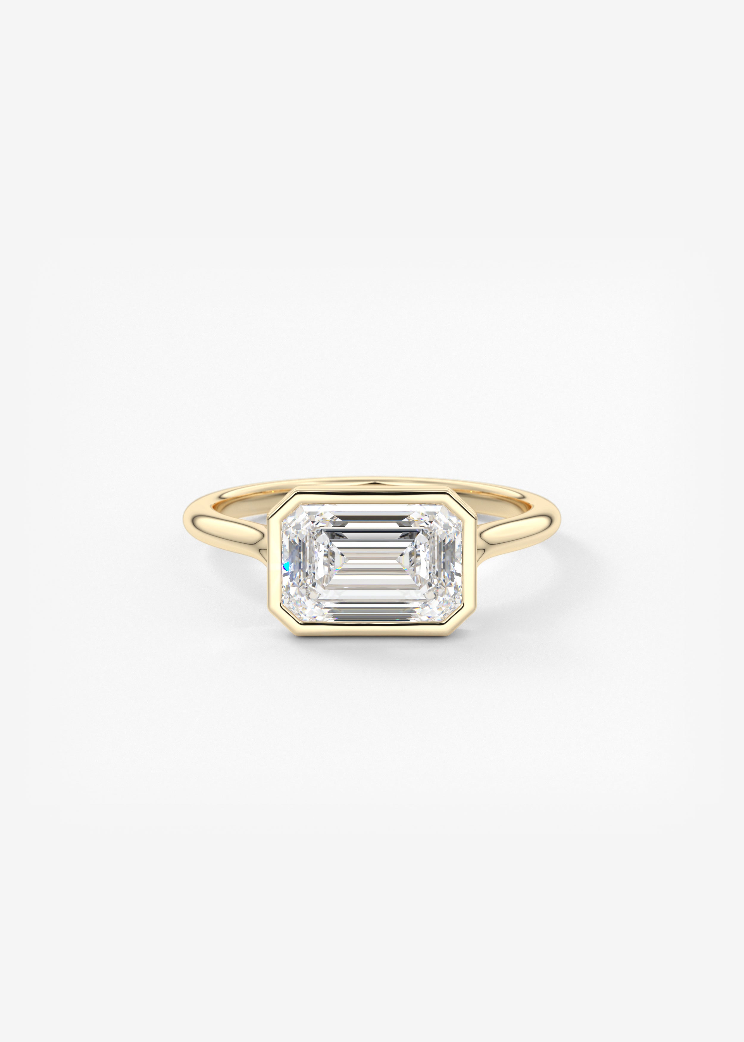 Breezy Bezel E.W. engagement in YG metal featuring Emerald,Radiant cut with Solitaire,Bezel setting