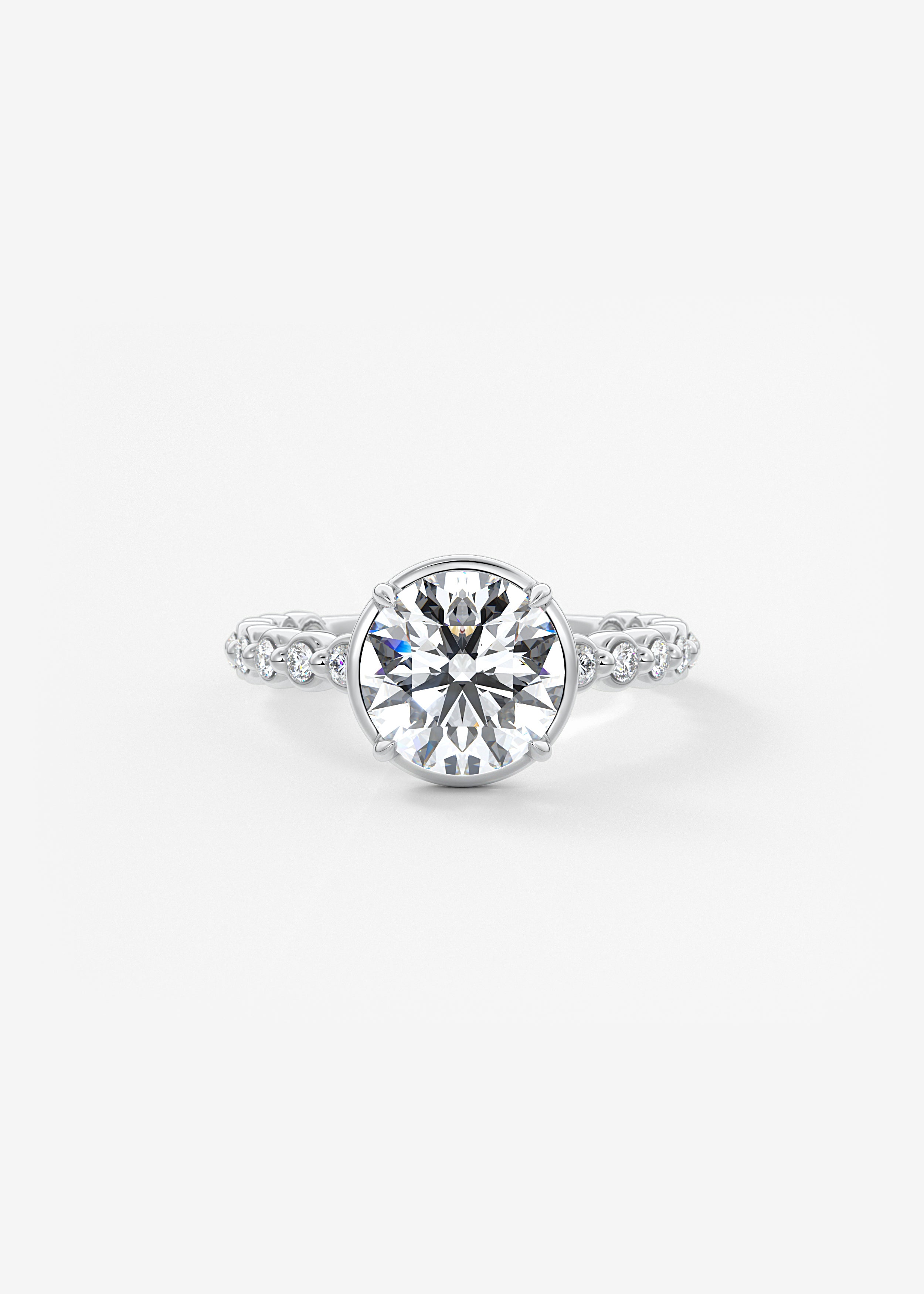The Cream Puff Eternity  engagement in WG metal featuring Round cut with Prong,Pave setting