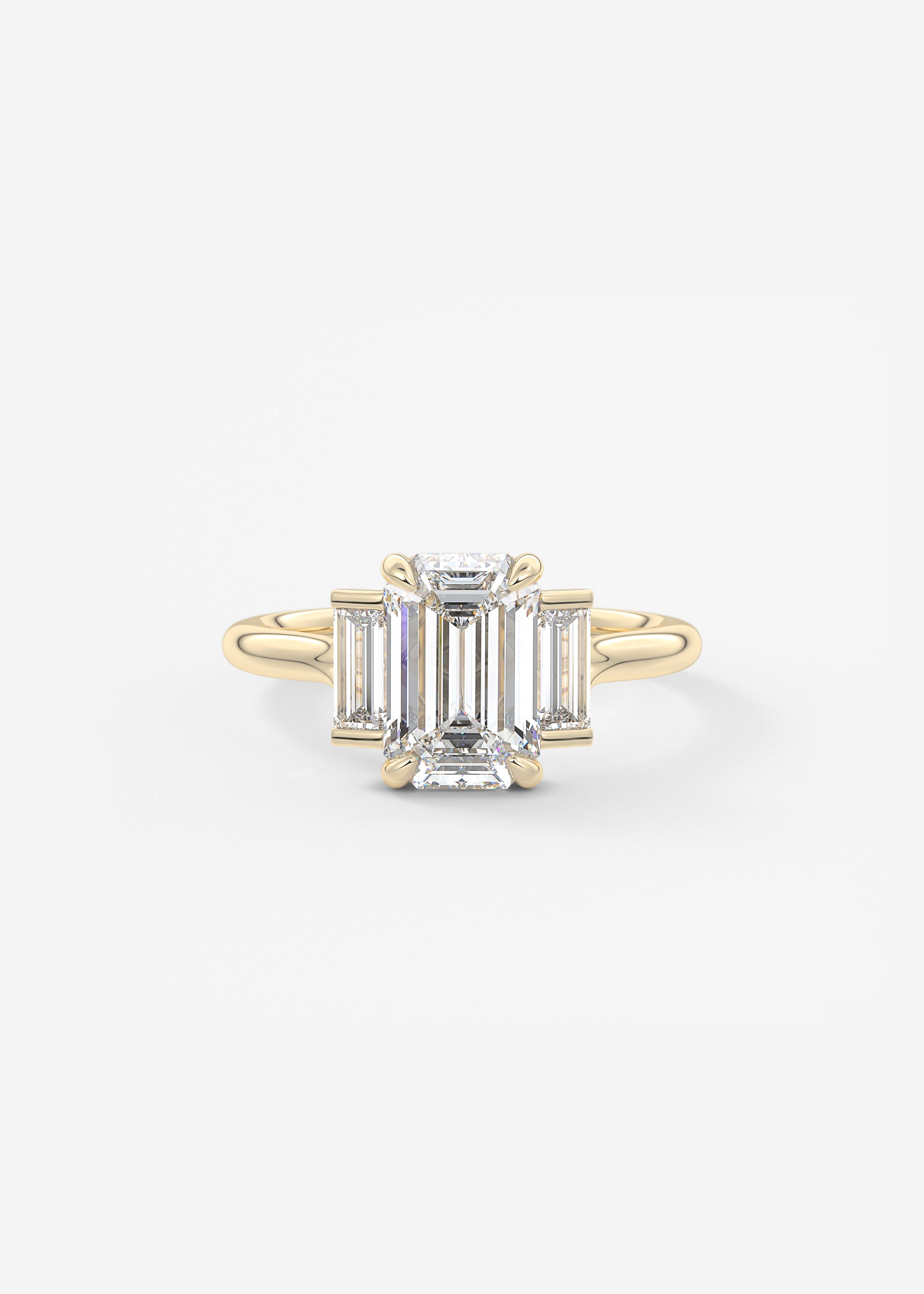 The Skyline  engagement in YG metal featuring Emerald,Radiant cut with Three Stone,Prong setting