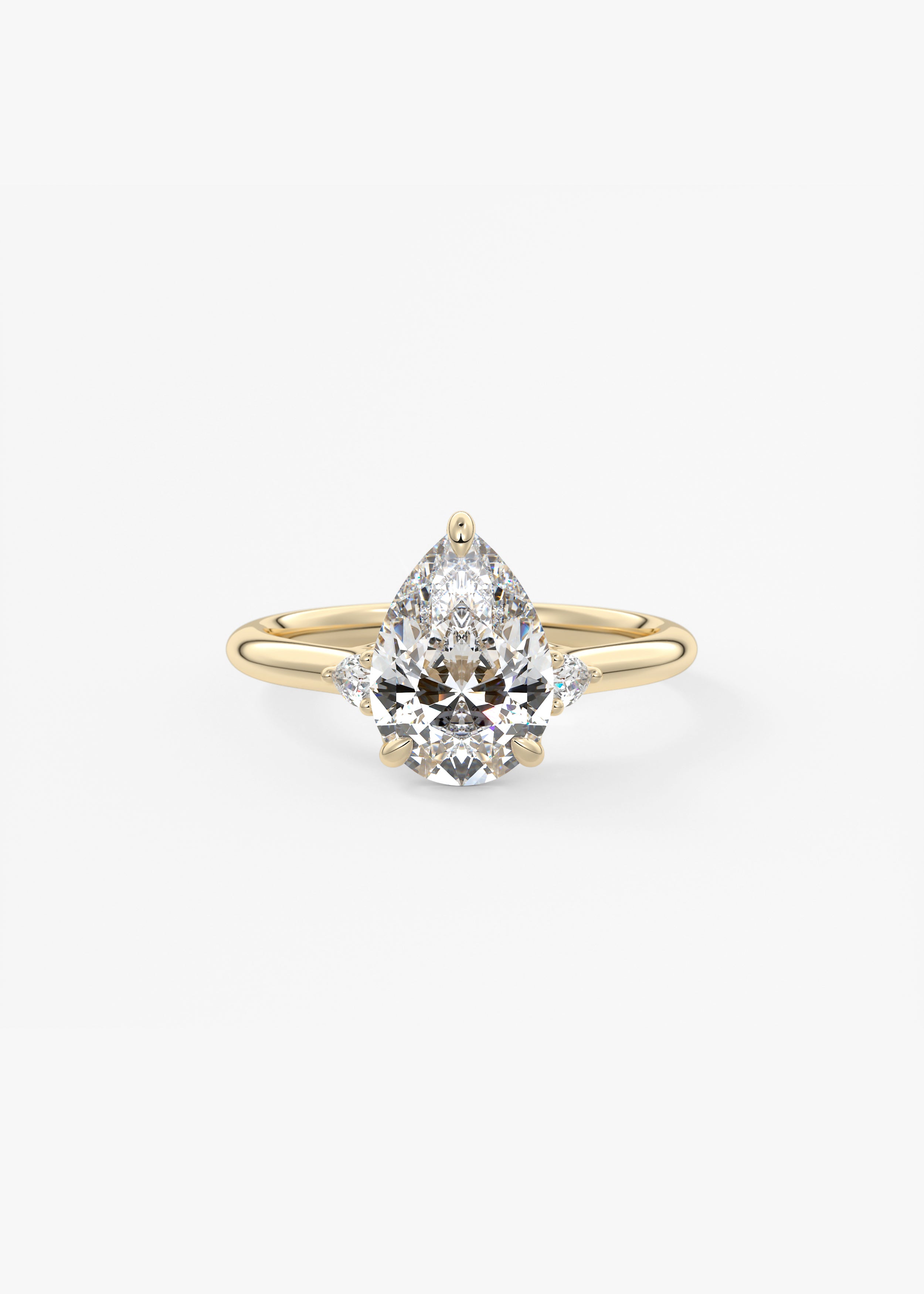 The Arbor Three Stone  engagement in YG metal featuring Pear cut with Three Stone,Prong,Nature Inspired setting