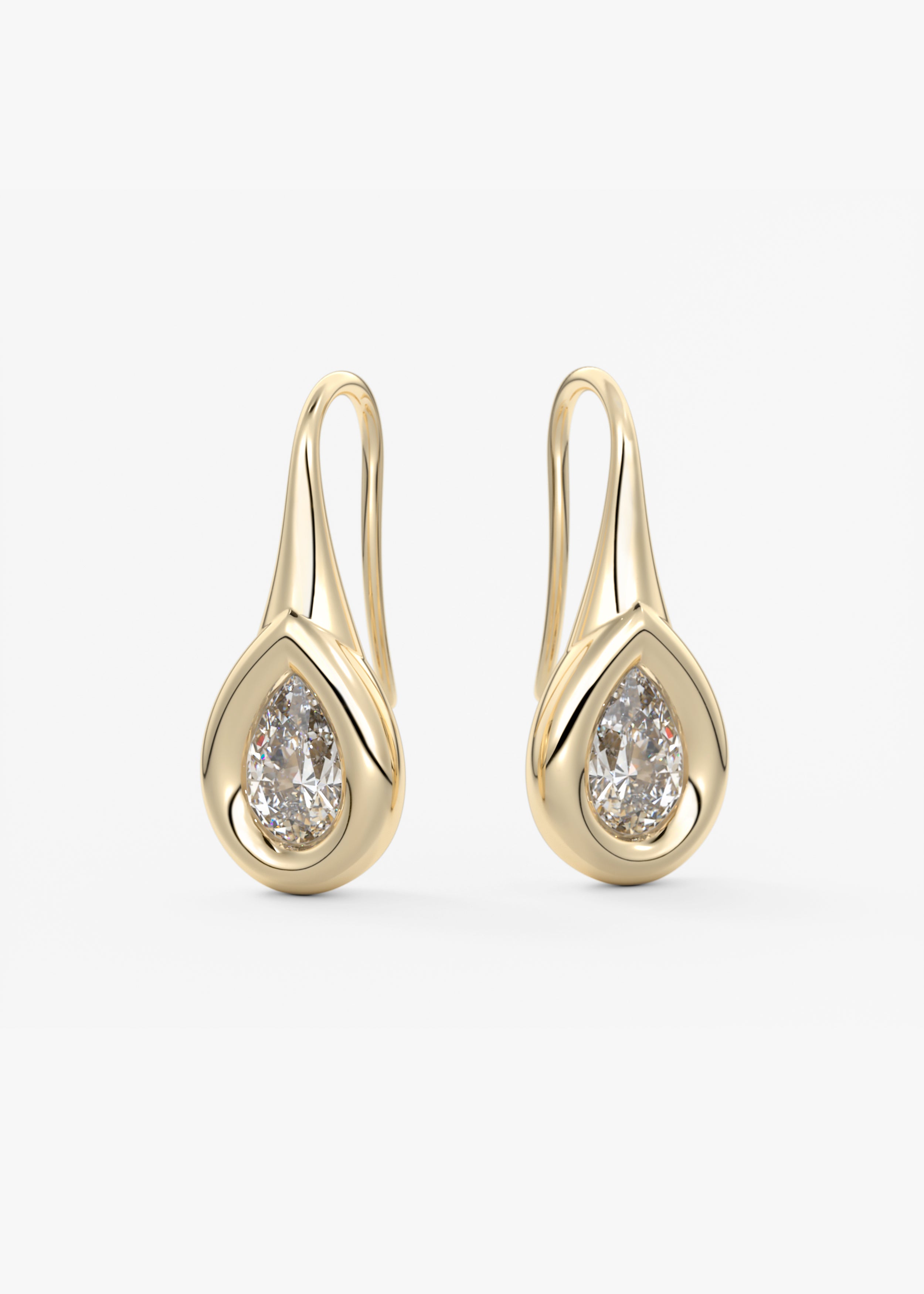 The Gumdrop  stud in YG metal featuring Pear cut with Bezel setting