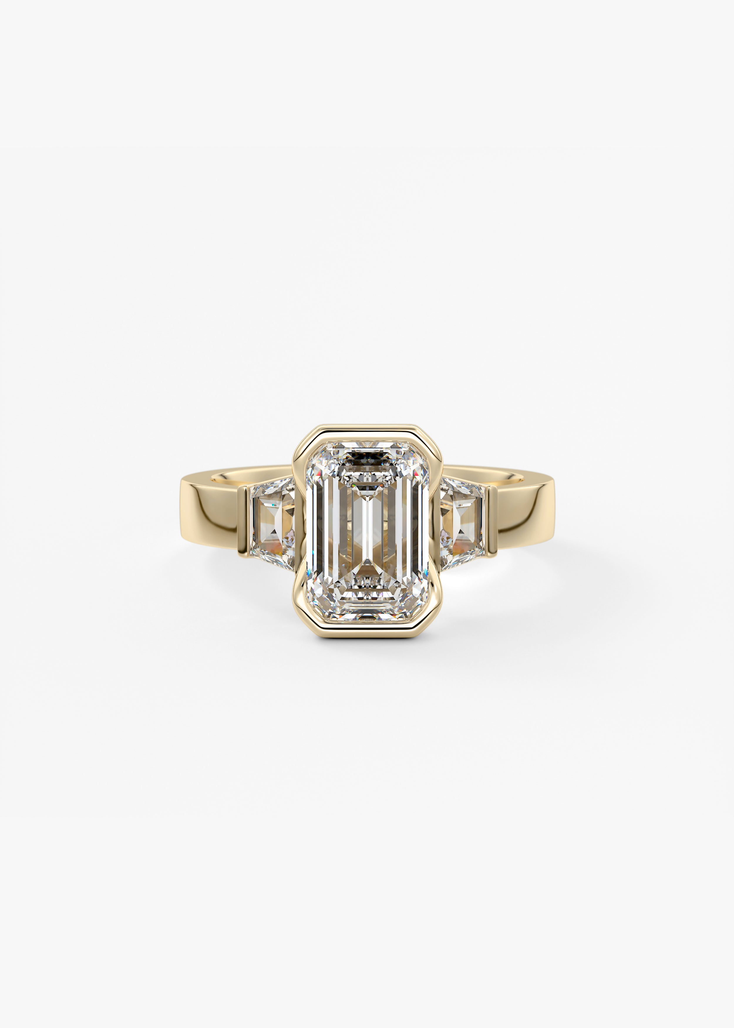 The Deco Clutch Three Stone  engagement in YG metal featuring Emerald,Radiant cut with Three Stone,Half Bezel setting