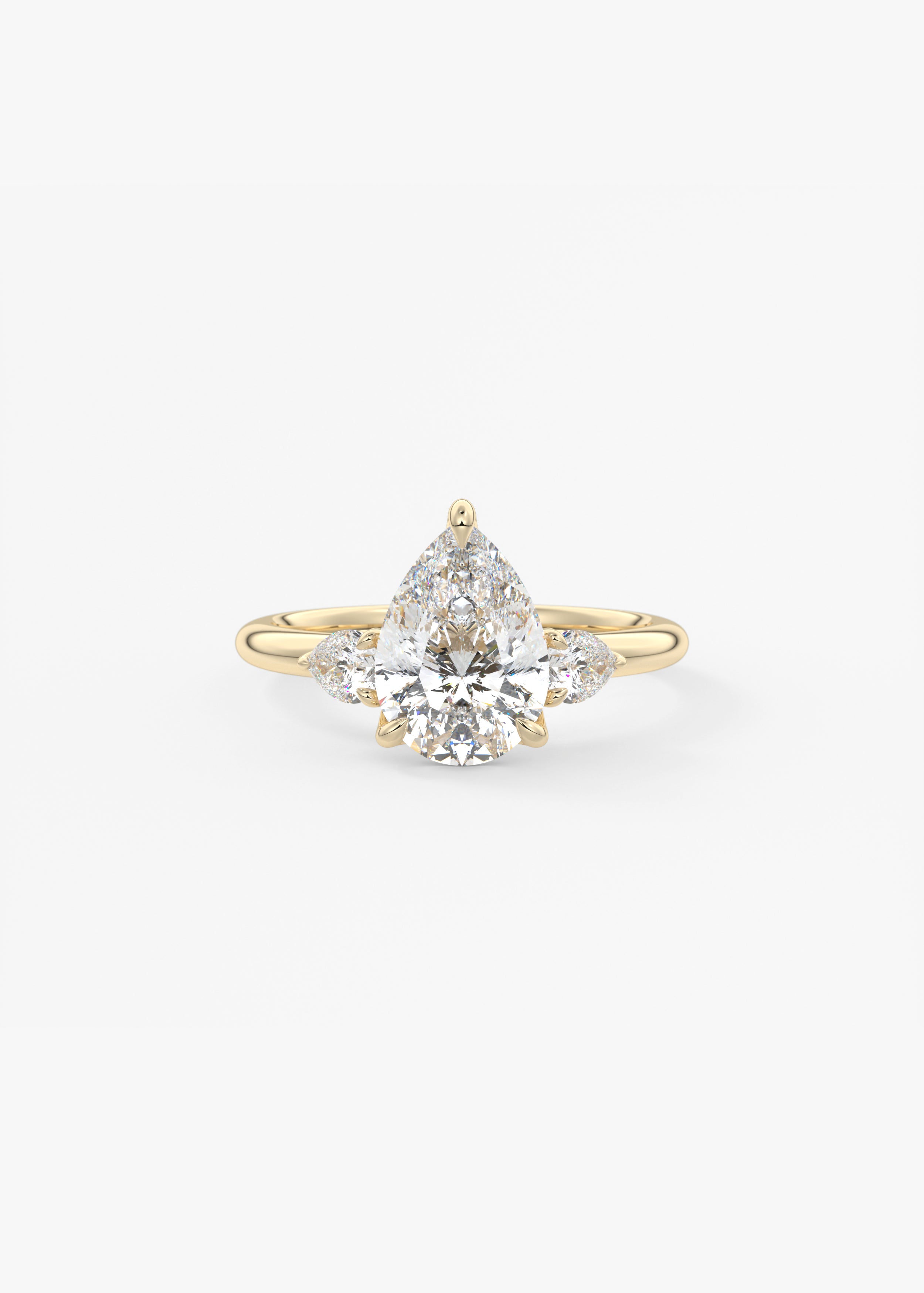 Royale Three Stone engagement in YG metal featuring Pear cut with Three Stone,Prong setting