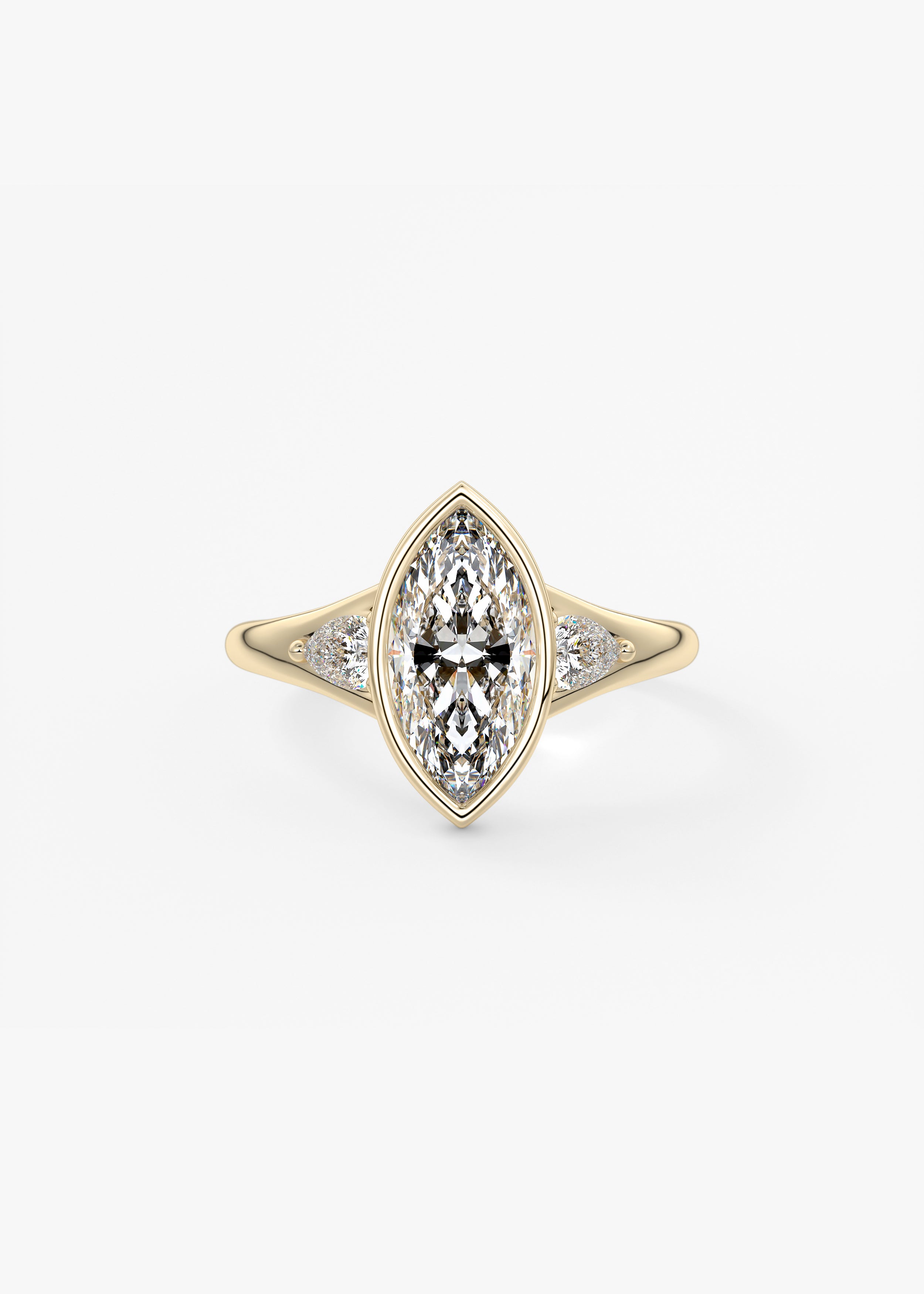 The Symphony Bezel  engagement in YG metal featuring Marquise cut with Three Stone,Bezel,Cluster,Split Shank setting