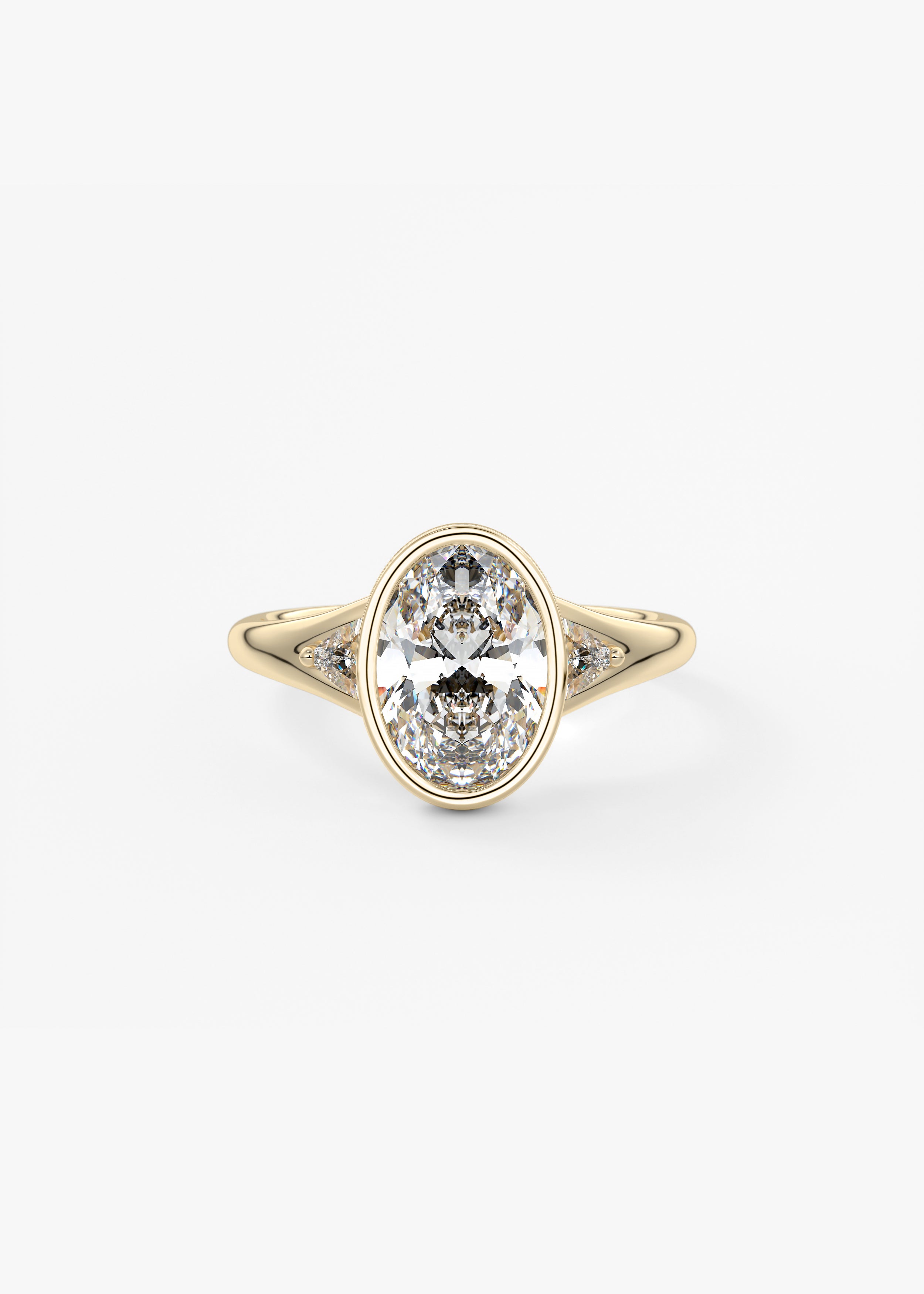The Symphony Bezel  engagement in YG metal featuring Oval cut with Three Stone,Bezel,Cluster,Split Shank setting