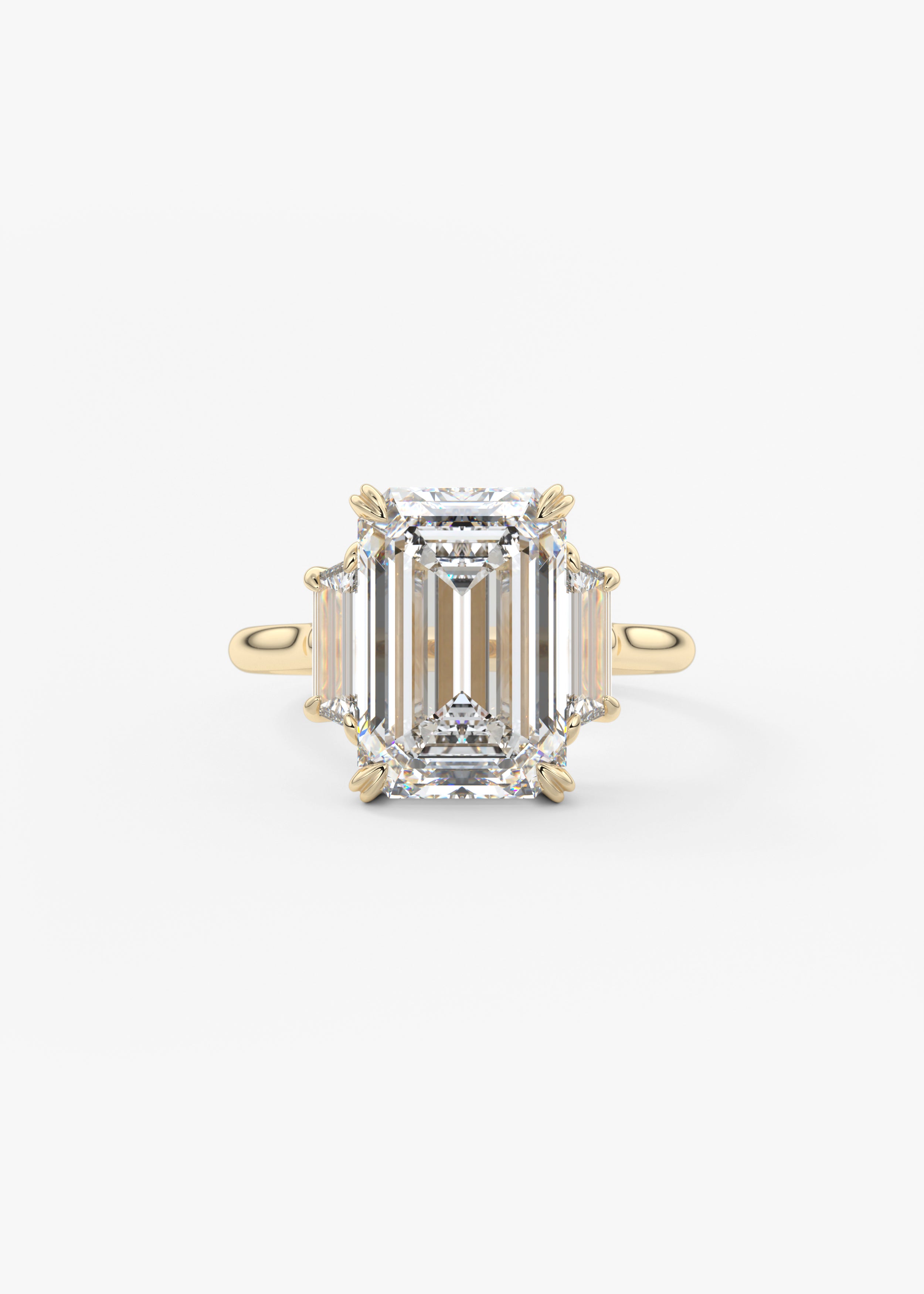 The Marguerite engagement in YG metal featuring Emerald cut with Prong,Three Stone setting