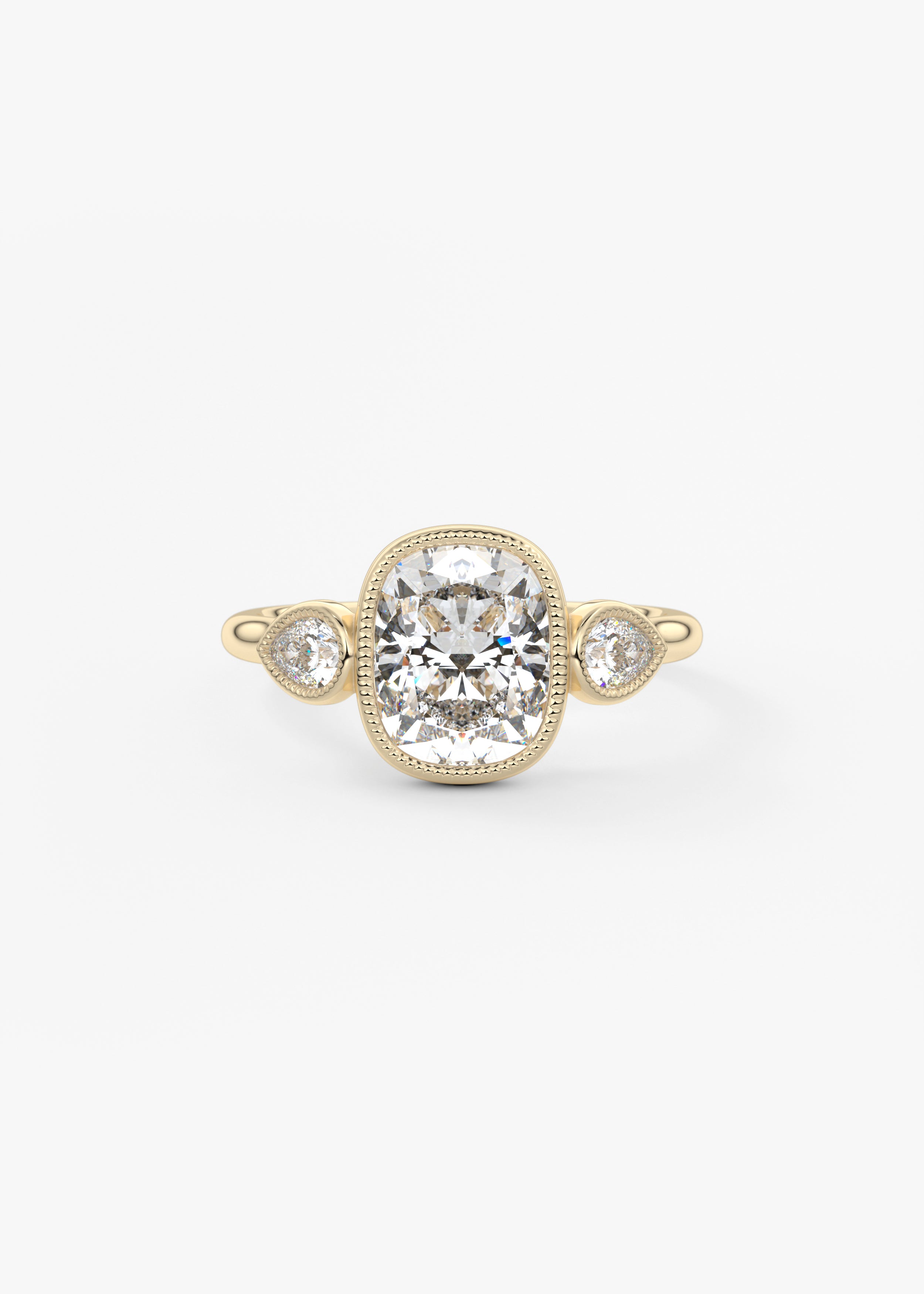 The Millie Three Stone engagement in YG metal featuring Elongated Cushion,Cushion,Old Mine, cut with Three Stone,Bezel,Vintage Inspired setting