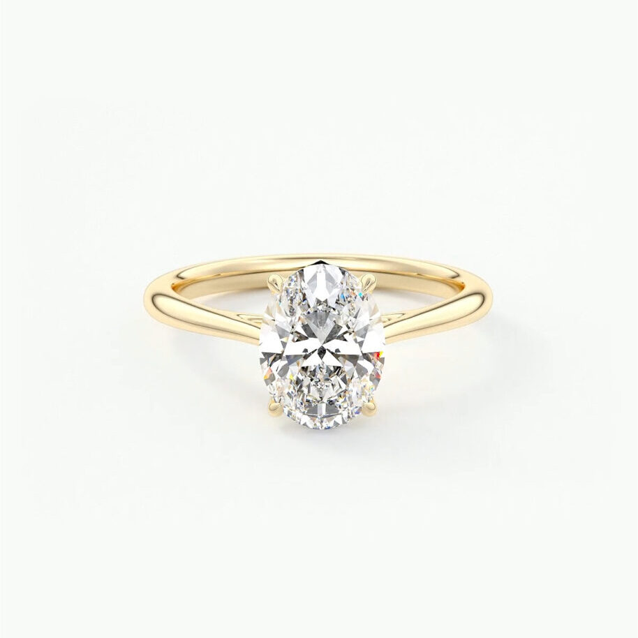 An oval cut solitaire engagement ring with tapered round band 
