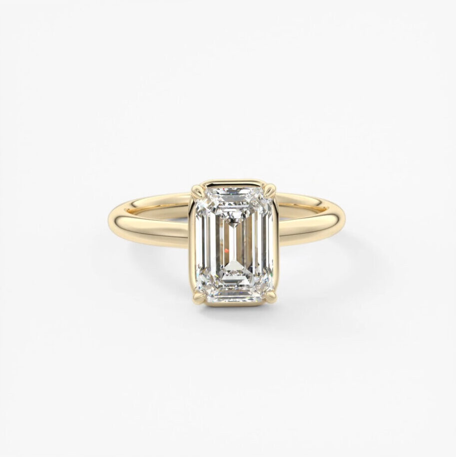 A collet set lab grown engagement ring in 18k yellow gold 