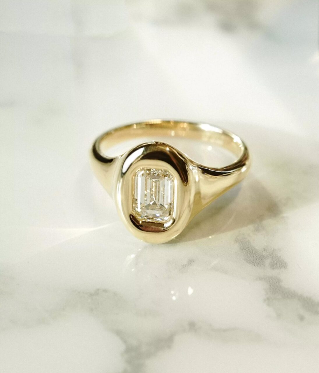 An emerald cut diamond in our gumdrop setting 
