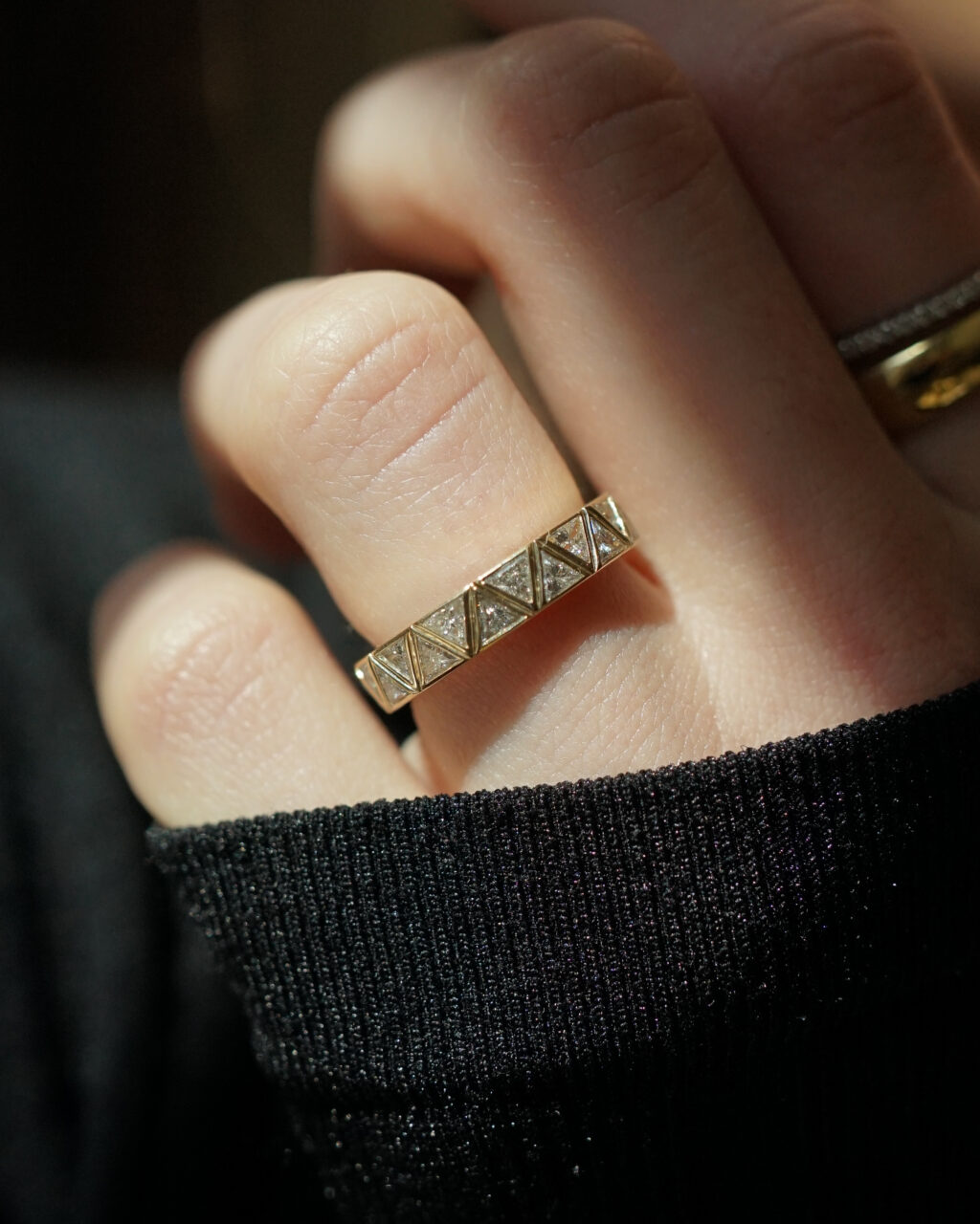 A unique men's wedding band with trillion cut diamonds