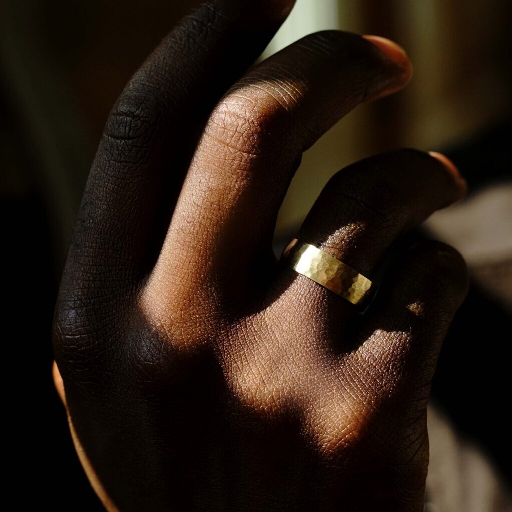 A pressed yellow gold wedding band