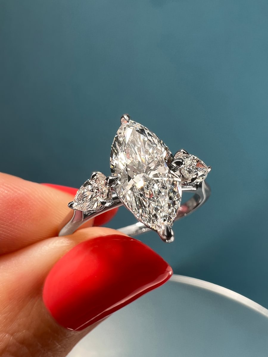 marquise cut diamond three stone engagement ring