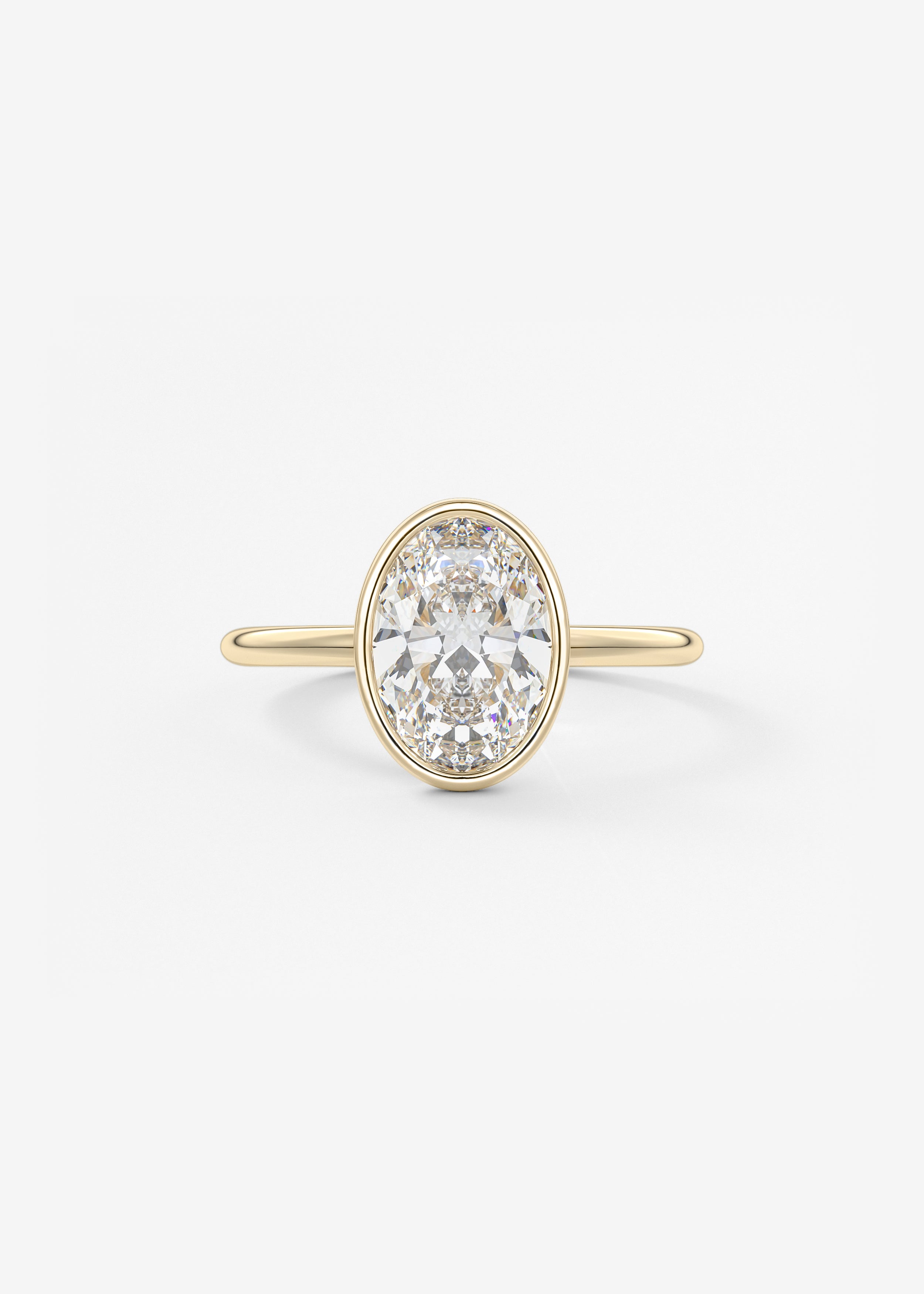 The Daily Bezel engagement in YG metal featuring Oval cut with Solitaire,Bezel setting