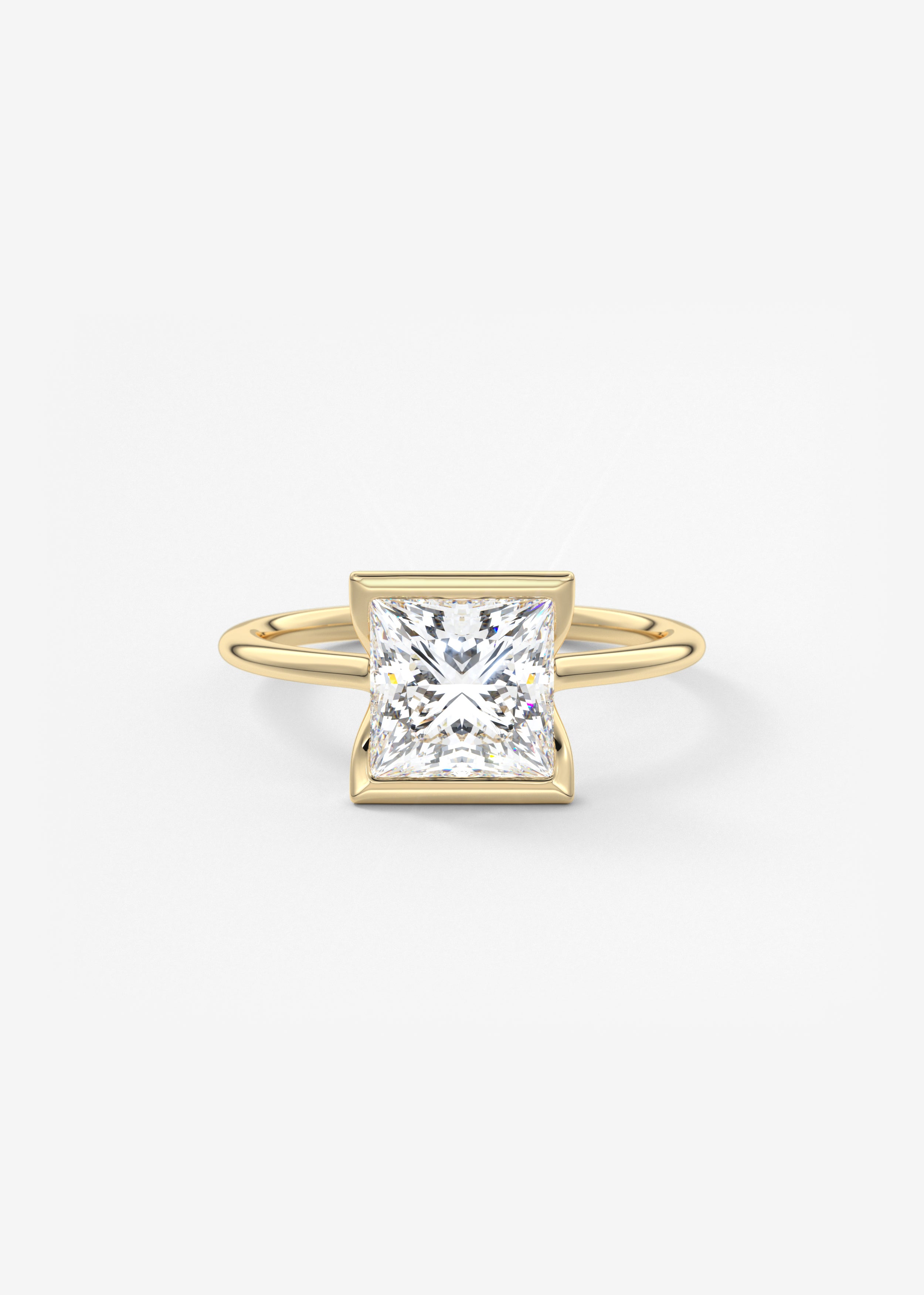 The Clutch  engagement in YG metal featuring Princess cut with Three Stone,Half Bezel setting