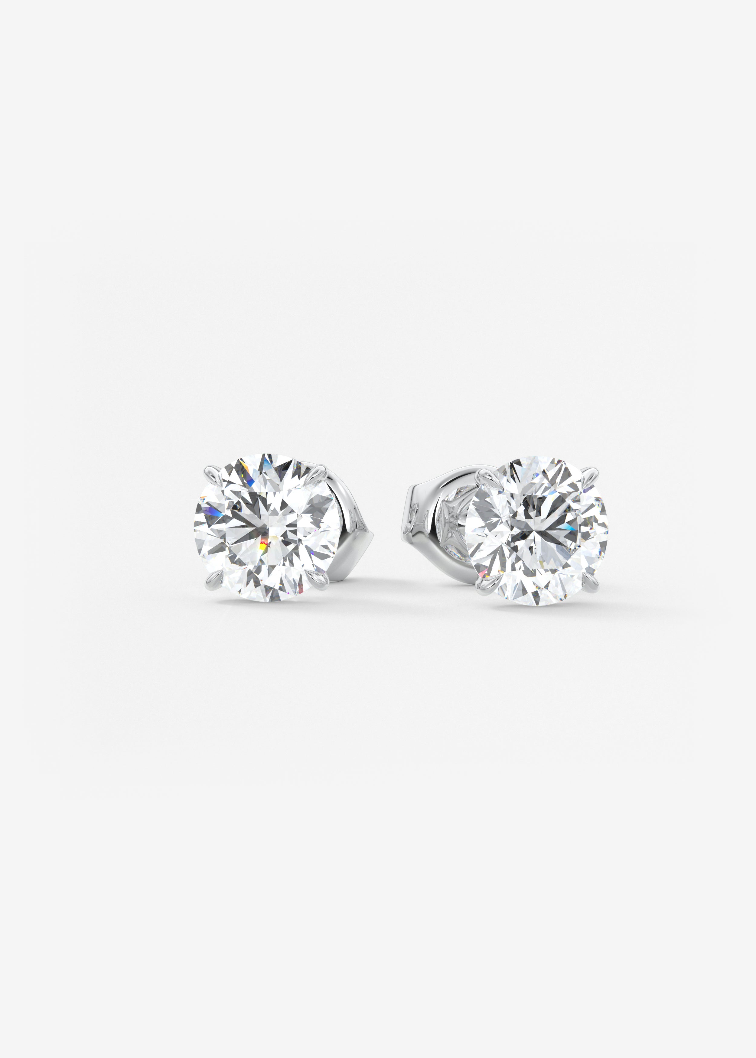 Single Scoop stud in WG metal featuring Round,Round Brilliant cut with Prong,Solitaire setting