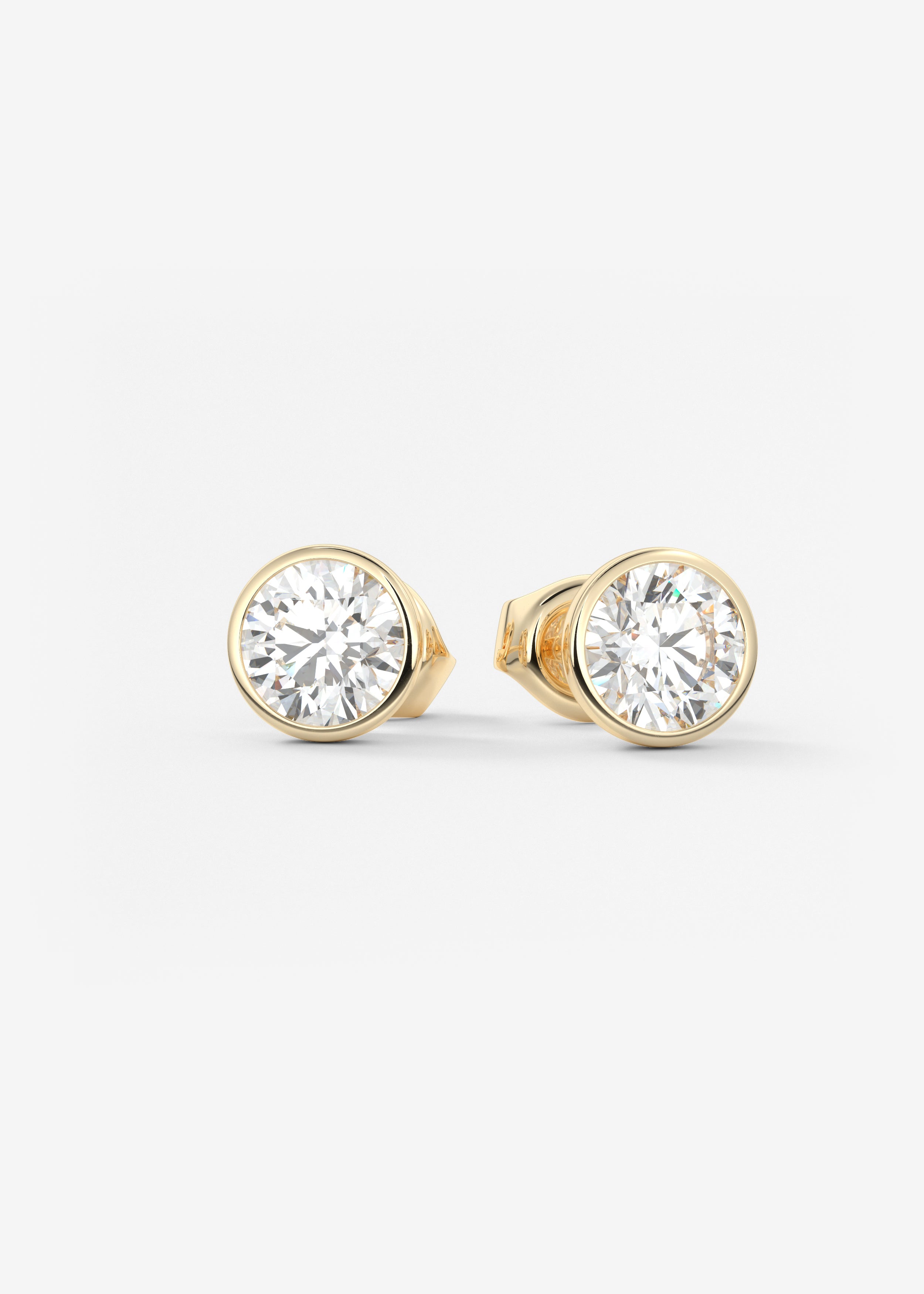 The Lowrider  stud in YG metal featuring Round,Round Brilliant cut with Bezel,Solitaire setting